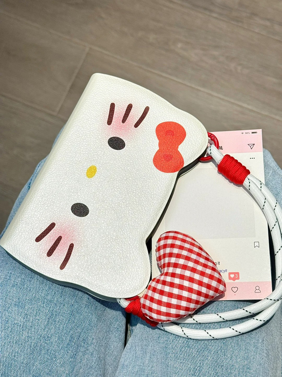 Hello Kitty Flip phone case with heart pendant