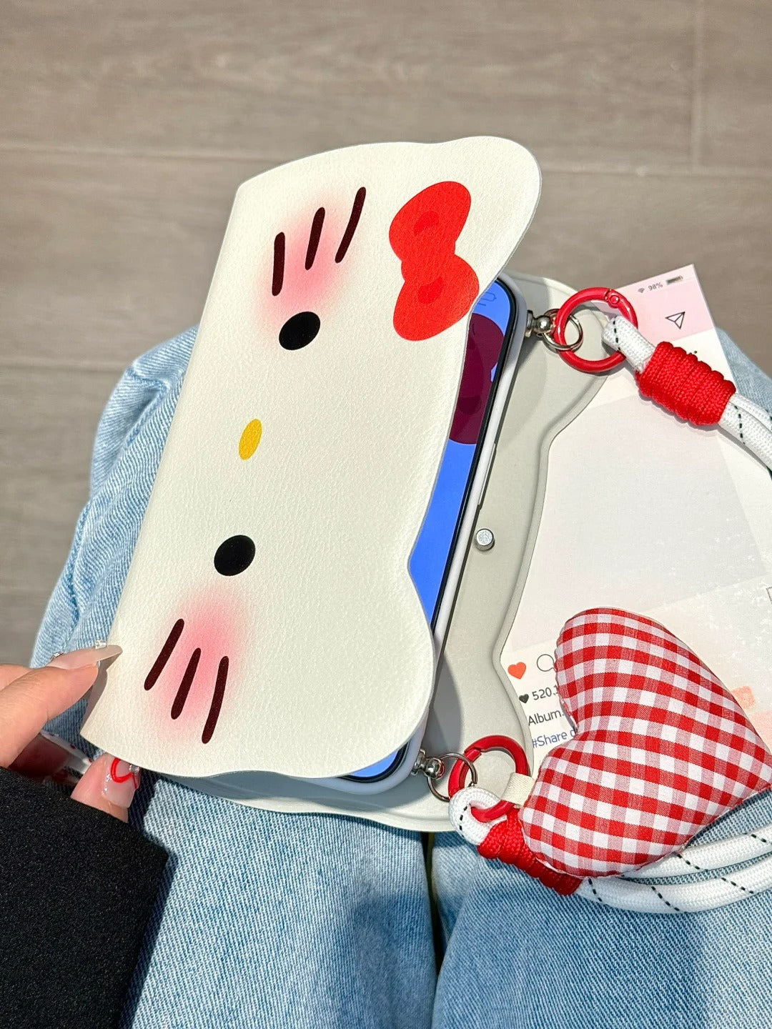 Hello Kitty Flip phone case with heart pendant